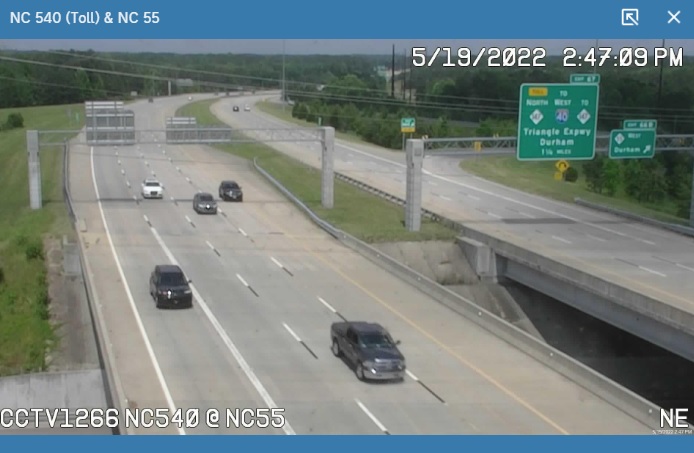 Image of overhead signage at ramp to NC 55 West on NC 540 showing no update to NC 885 signs, May 2022