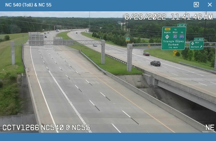 Traffic camera image showing new NC 885 and I-885 shields on Triangle Parkway 1 1/4 Miles advance sign at NC 55 exit on NC 540 East, June 2022