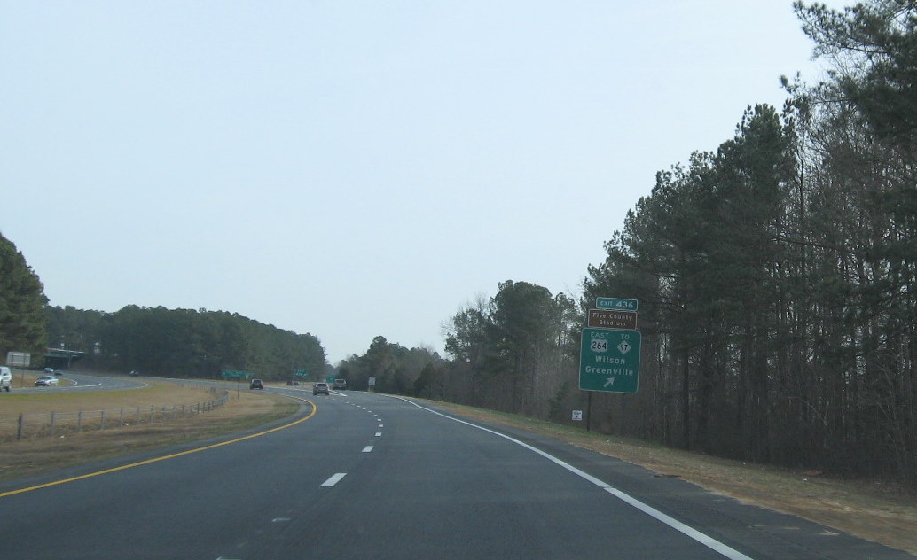 Photo of exit signage for Wendell interchange with US 64/264 in January 2010